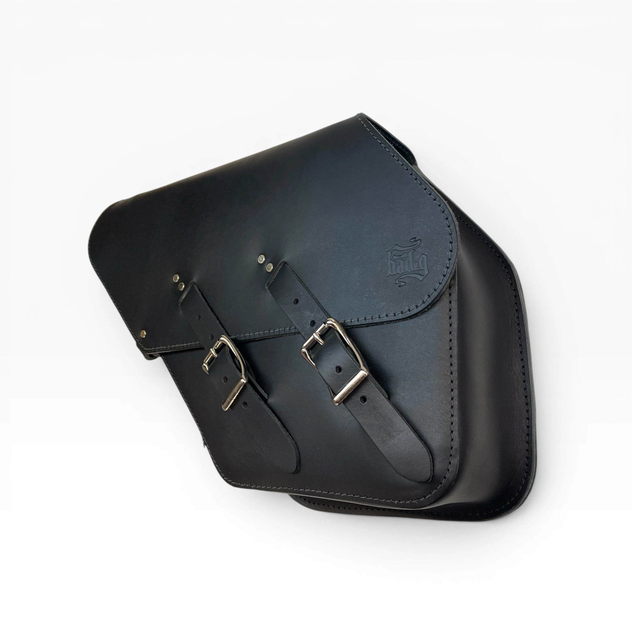 Black leather motorcycle saddle bag with two adjustable buckle straps and silver metal hardware, shown on a plain white background.