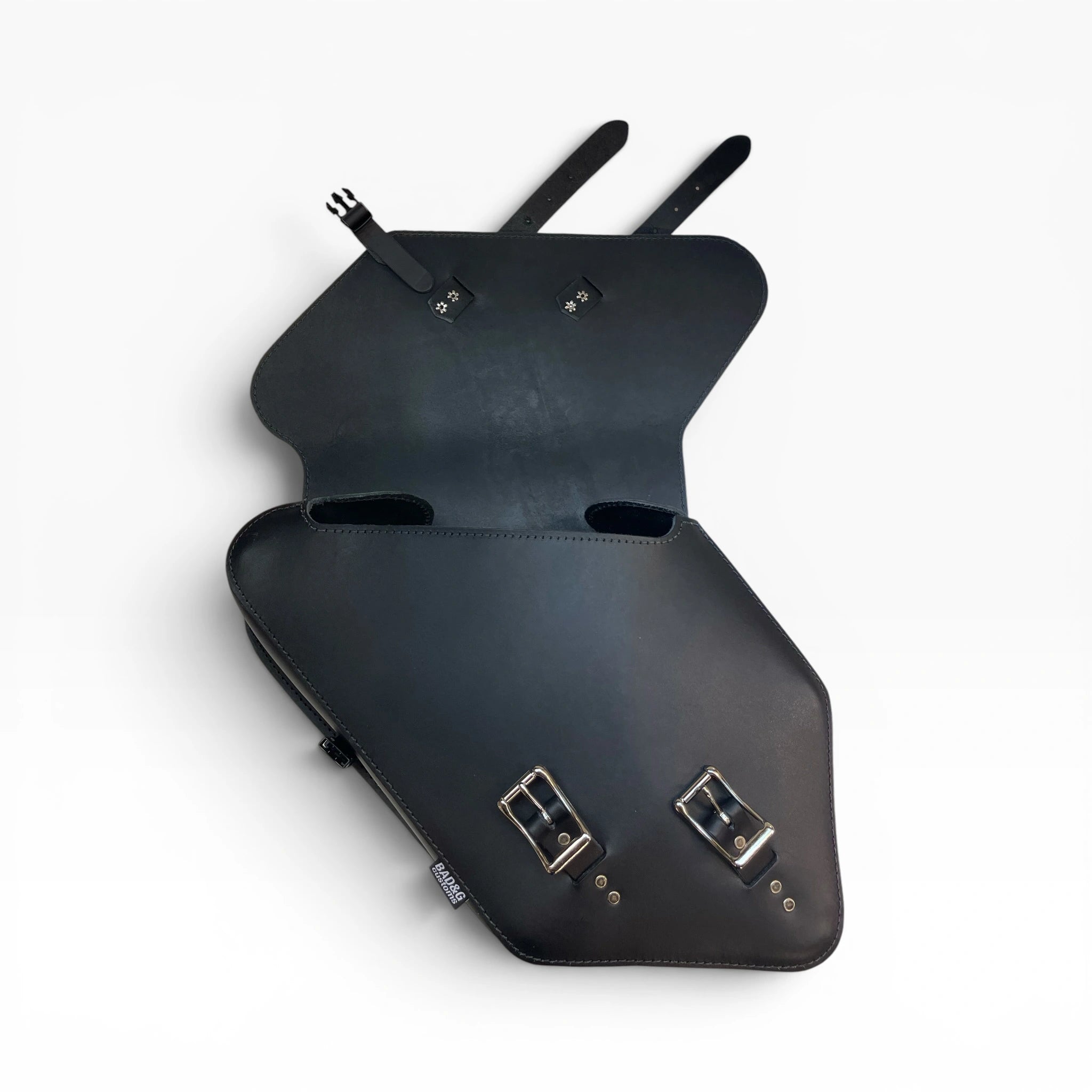 Black leather motorcycle saddle bags shown open to display the interior and buckle closures, set against a plain white background.