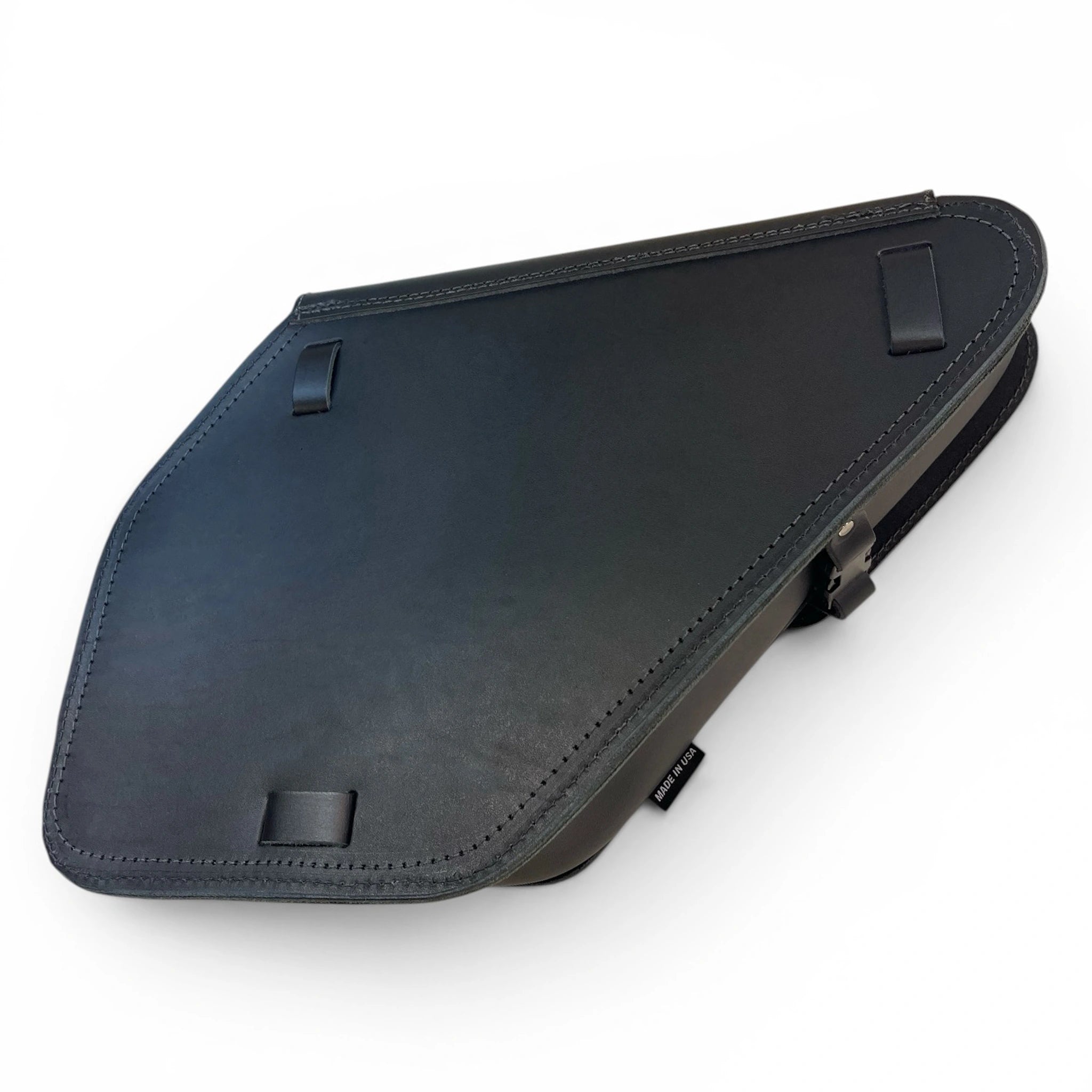 A black leather motorcycle saddle pad shown from an elevated angle on a white background.