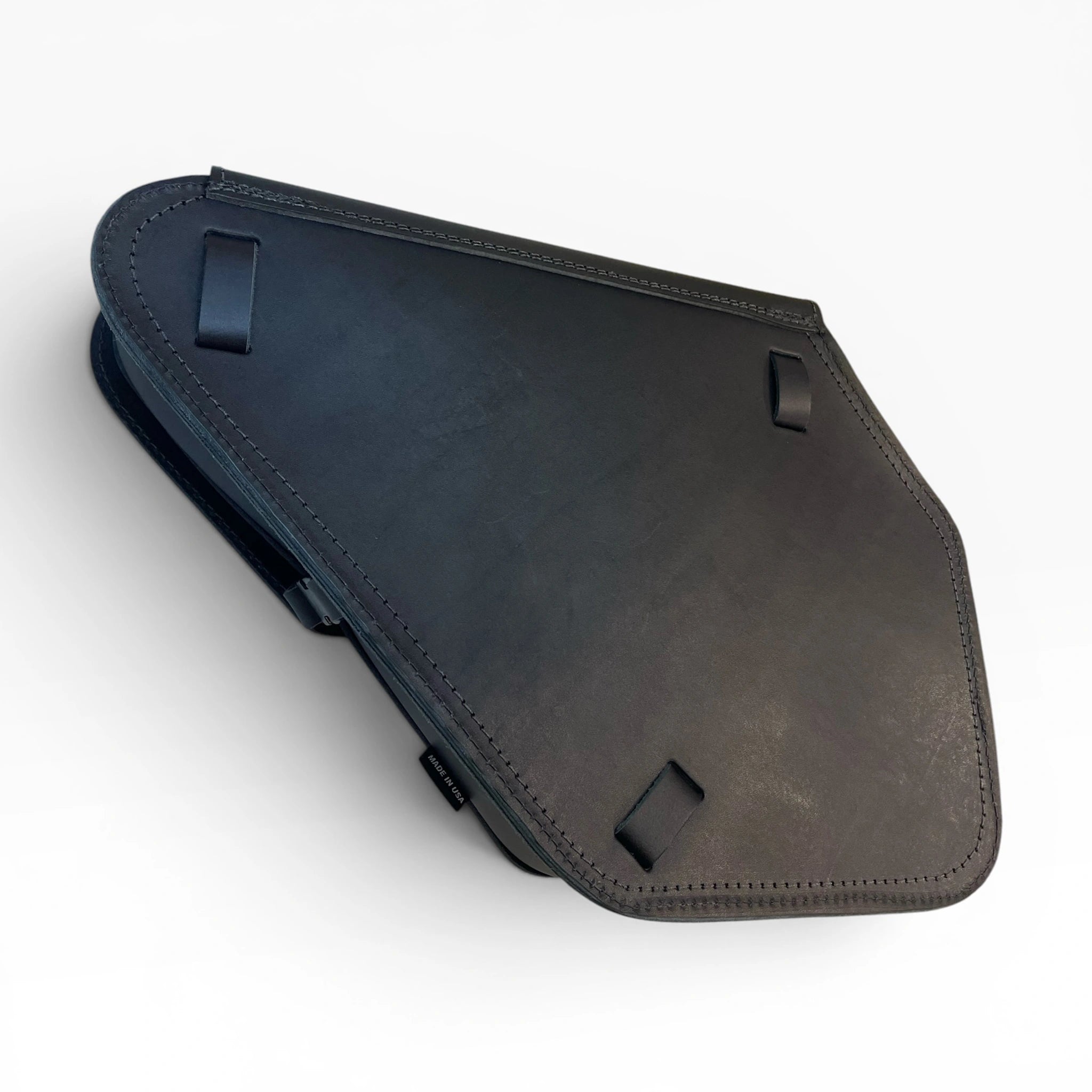 A dark gray leather motorcycle pannier case shown from an angled top-down view on a light gray background.