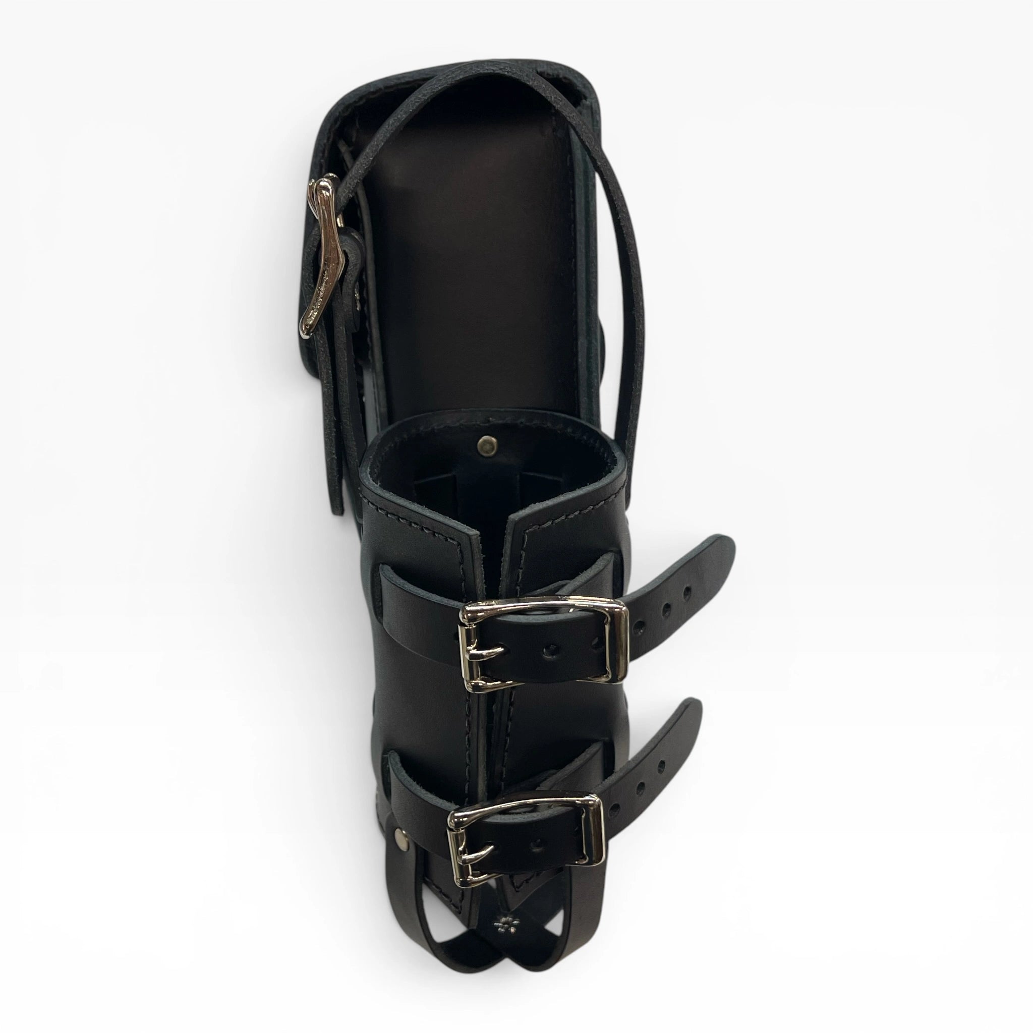 A black leather ankle boot with double buckle straps and a zippered side pocket, shown from a top-down angle on a white background.