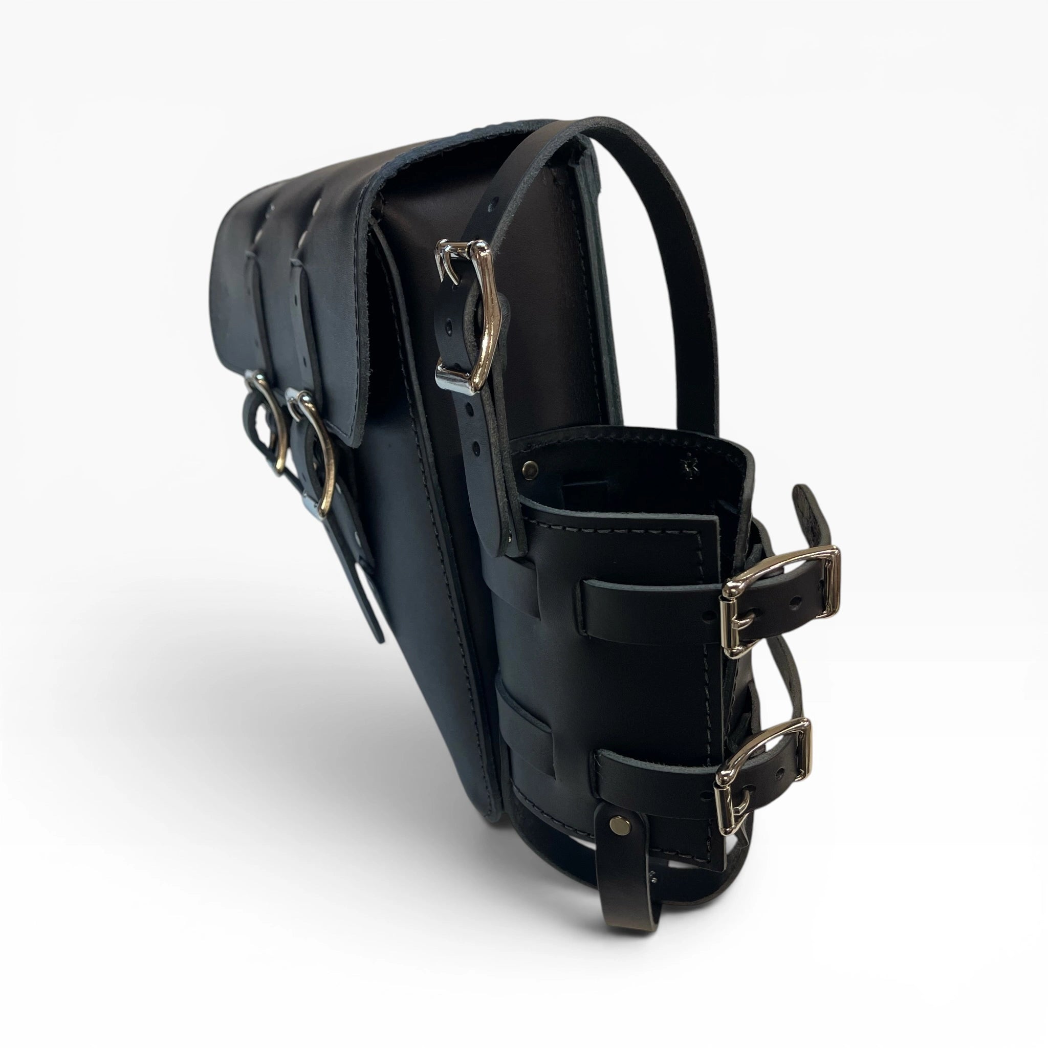 Black leather motorcycle saddlebag with silver-tone metal buckles, rings, and straps, shown from a three-quarters angle on a white background.